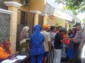 Babinkamtibmas Krembangan Utara Kawal Pengambilan Sembako BPNT