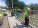 Polsek Pabean Cantikan Pantau Ketinggian Air di Sungai Kalimas