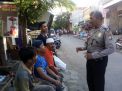 Babinkamtibmas Perak Timur Sampaikan Pesan Kamtibmas ke Warga Jalan Indrapura