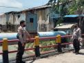 Polsek Krembangan Cek Ketinggian Debit Air Sungai, Terpantau Kondisi Dalam Batas Normal