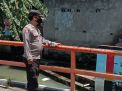 Polsek Krembangan Lakukan Kegiatan Rutin Cek Ketinggian Debit Air, Waspada Adanya Potensi Banjir