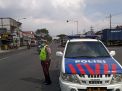 Polsek Krembangan Pantau Arus Lalu Lintas Jalan Kalianak, Pastikan Situasi Lancar