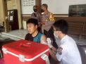 Polsek Kenjeran Laksanakan Pengamanann Vaksinasi di Mako Polsek Kenjeran, Pastikan Kegiatan Berjalan Lancar