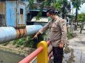 Polsek Krembangan Laksanakan Pengecekan Pintu-Pintu Air, Terpantau Dalam Kondisi Aman dan Normal