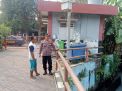 Polsek Krembangan Antisipasi Potensi Banjir Melalui Pengecekan Debit Rutin Ketinggian Air Sungai